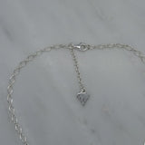 three silver circle pendant