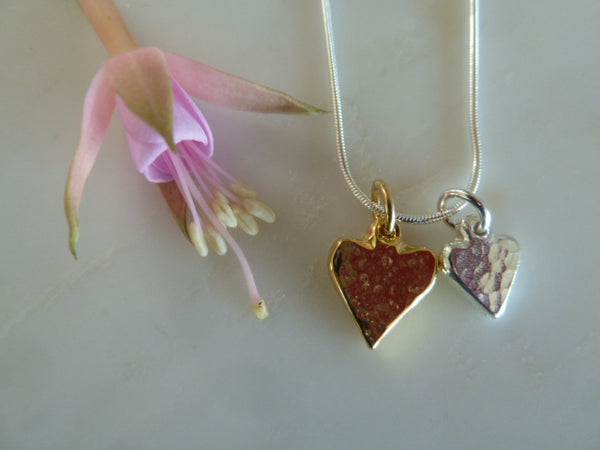 large gold & small silver solid heart pendant
