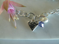 silver oval link solid heart charm bracelet