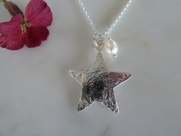 small silver star pendant