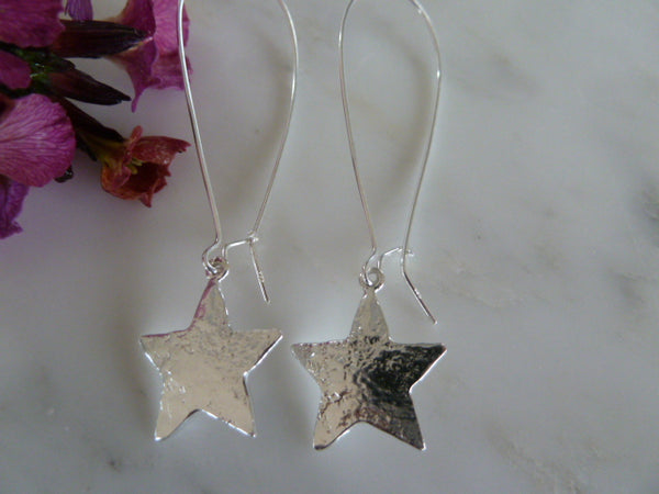 silver star earrings on long earwire
