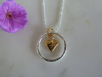silver circle & gold heart pendant