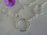 three silver circle pendant