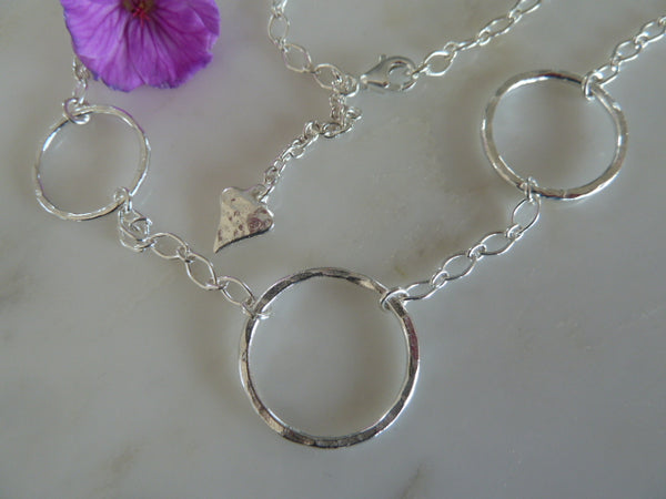 three silver circle pendant