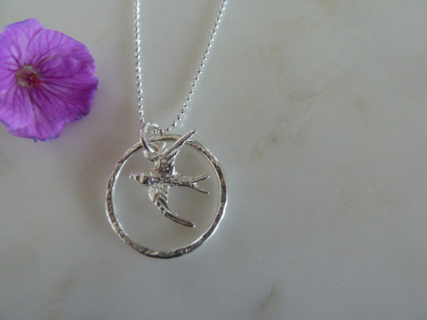silver circle & swallow pendant