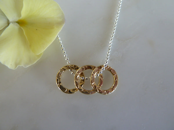 gold textured three circle pendant