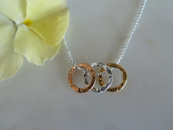 silver, gold & rose gold textured three circle pendant