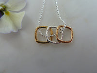 silver, gold & rose gold three large square pendant
