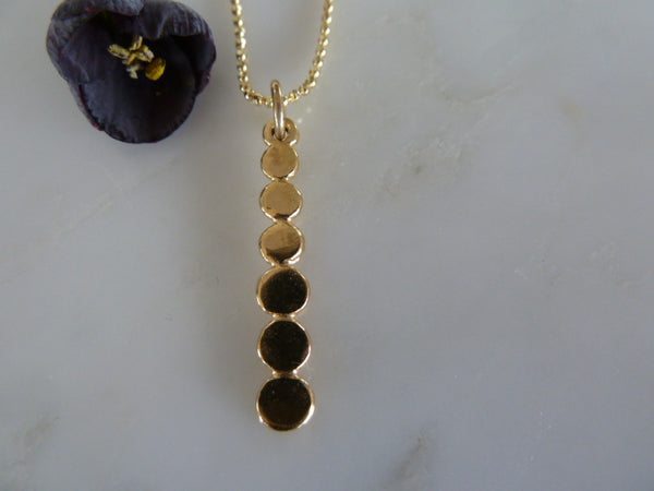 gold six dot pendant